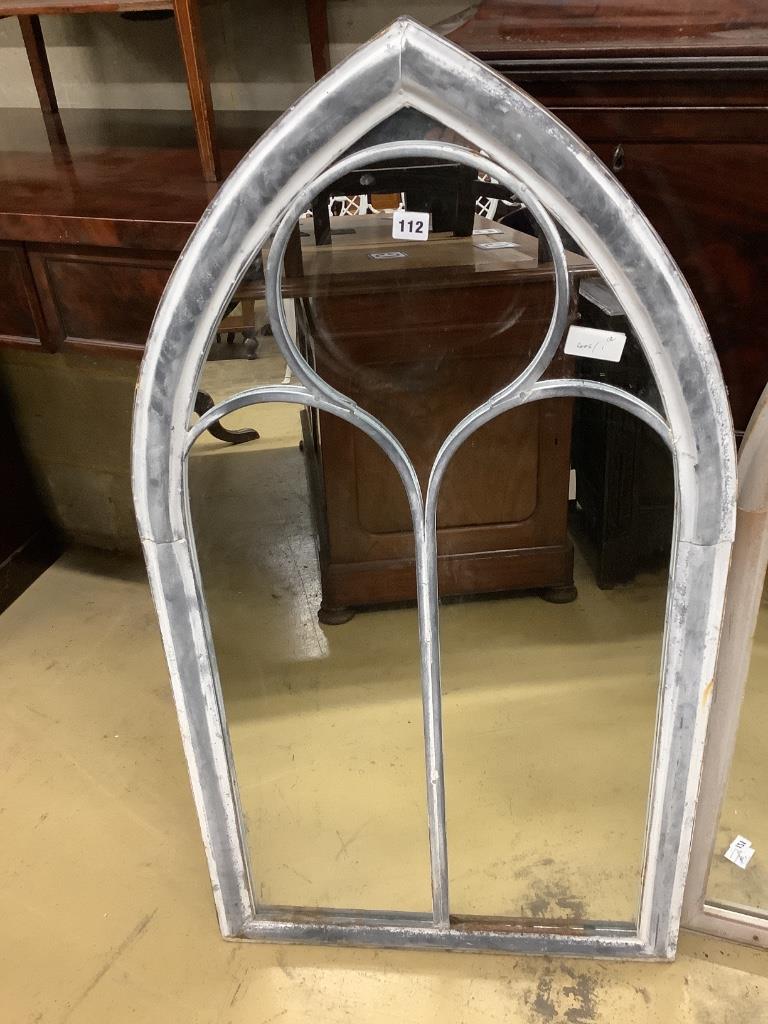 A pair of metal framed lancet arched wall mirrors, width 60cm height 110cm